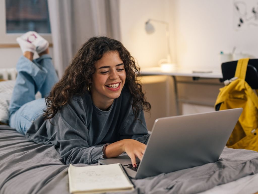 female college student on the bed