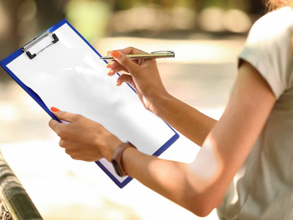 student holding a clipboard