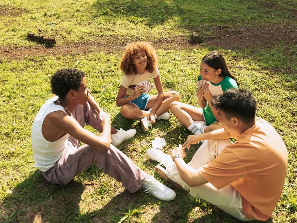 teenagers talking in a circle in the garden