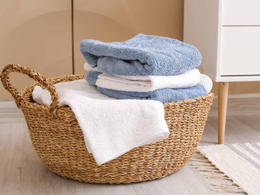 woven basket with towels inside