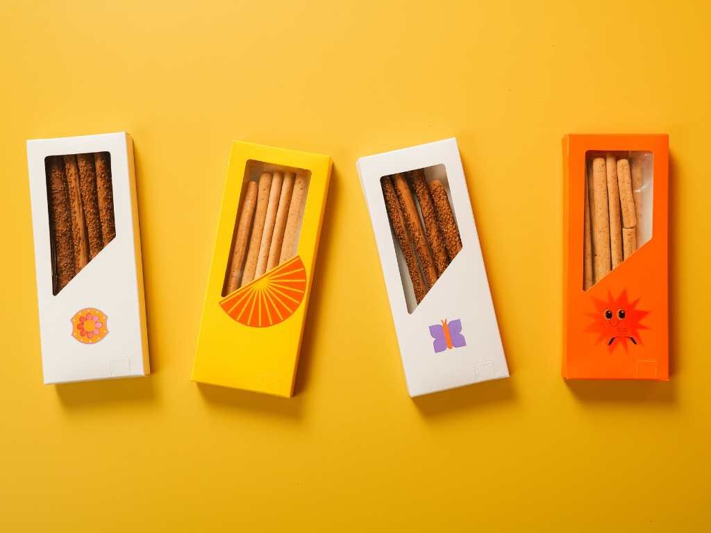 biscuits in small boxes on top of a yellow table