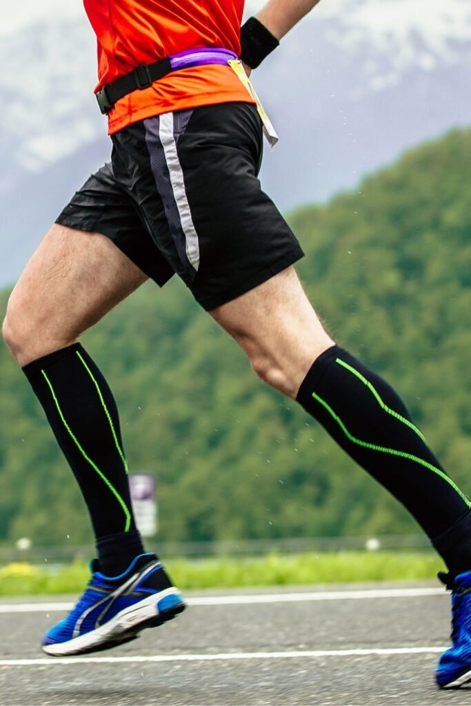 soccer player running on the field wearing compression socks
