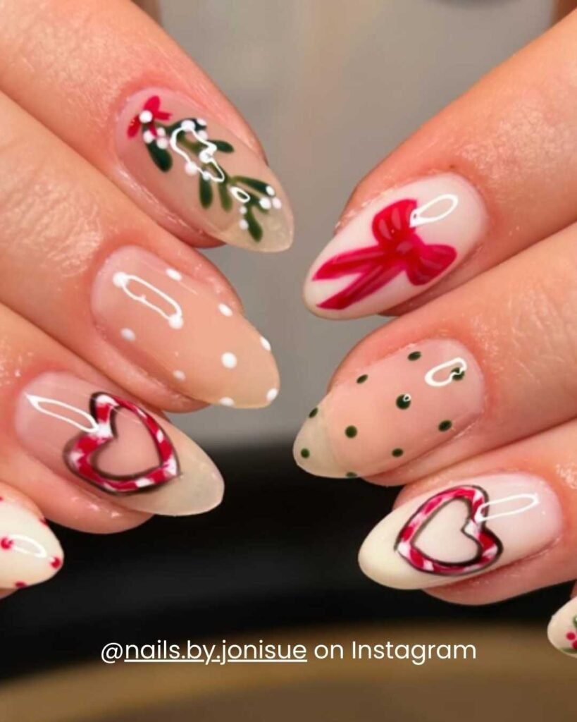 Whimsical nails with candy-cane-inspired heart outlines, a red bow, polka dots, and holly details.