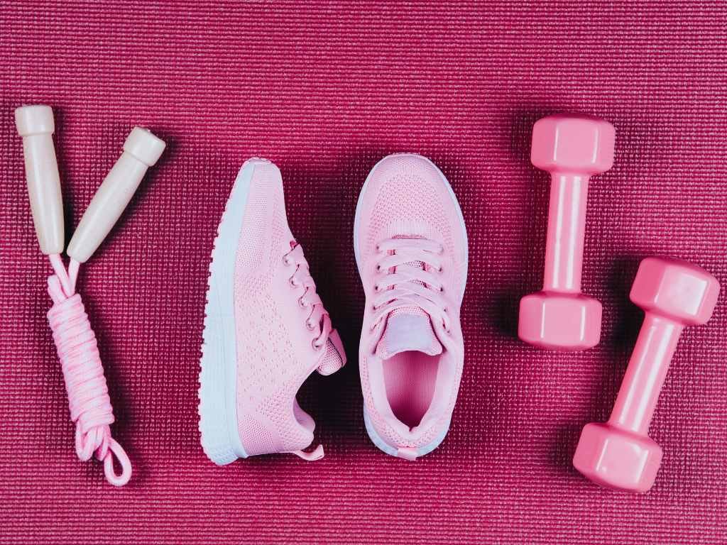 pink gym equipment on a dark pink carpet