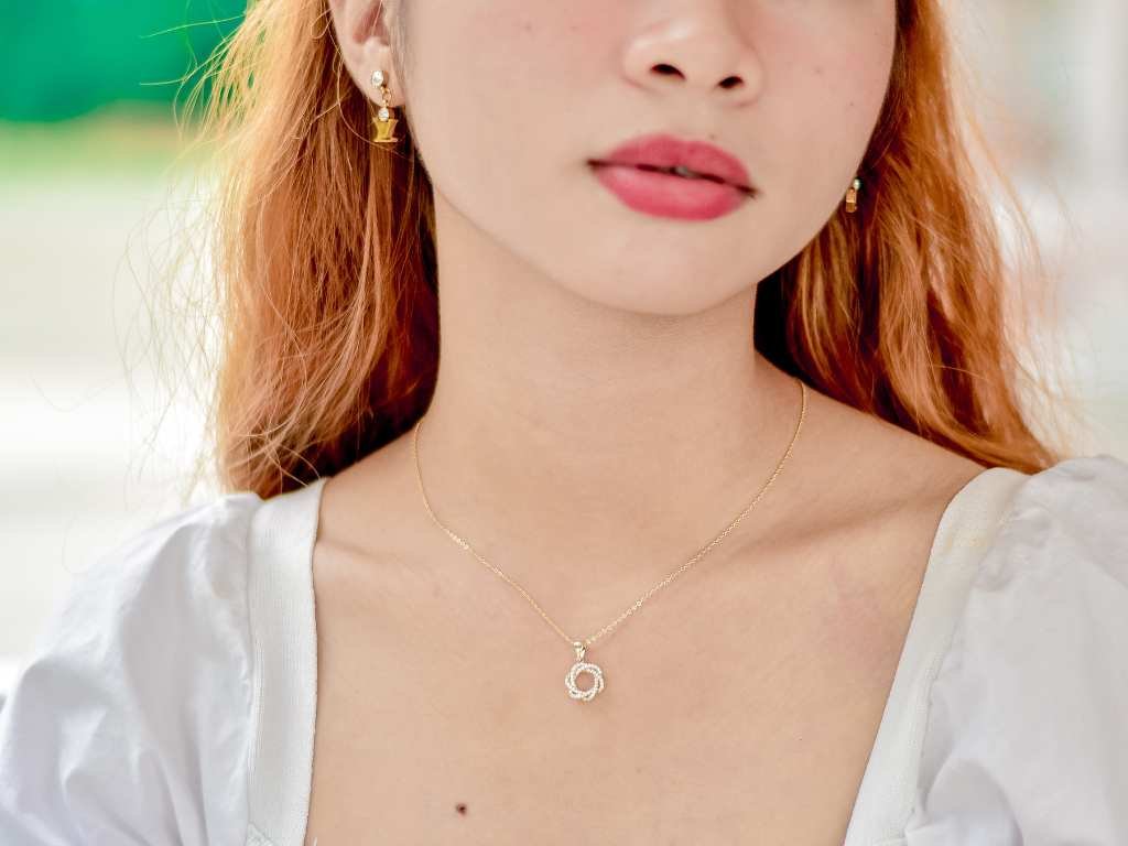 asian woman wearing a personalized necklace