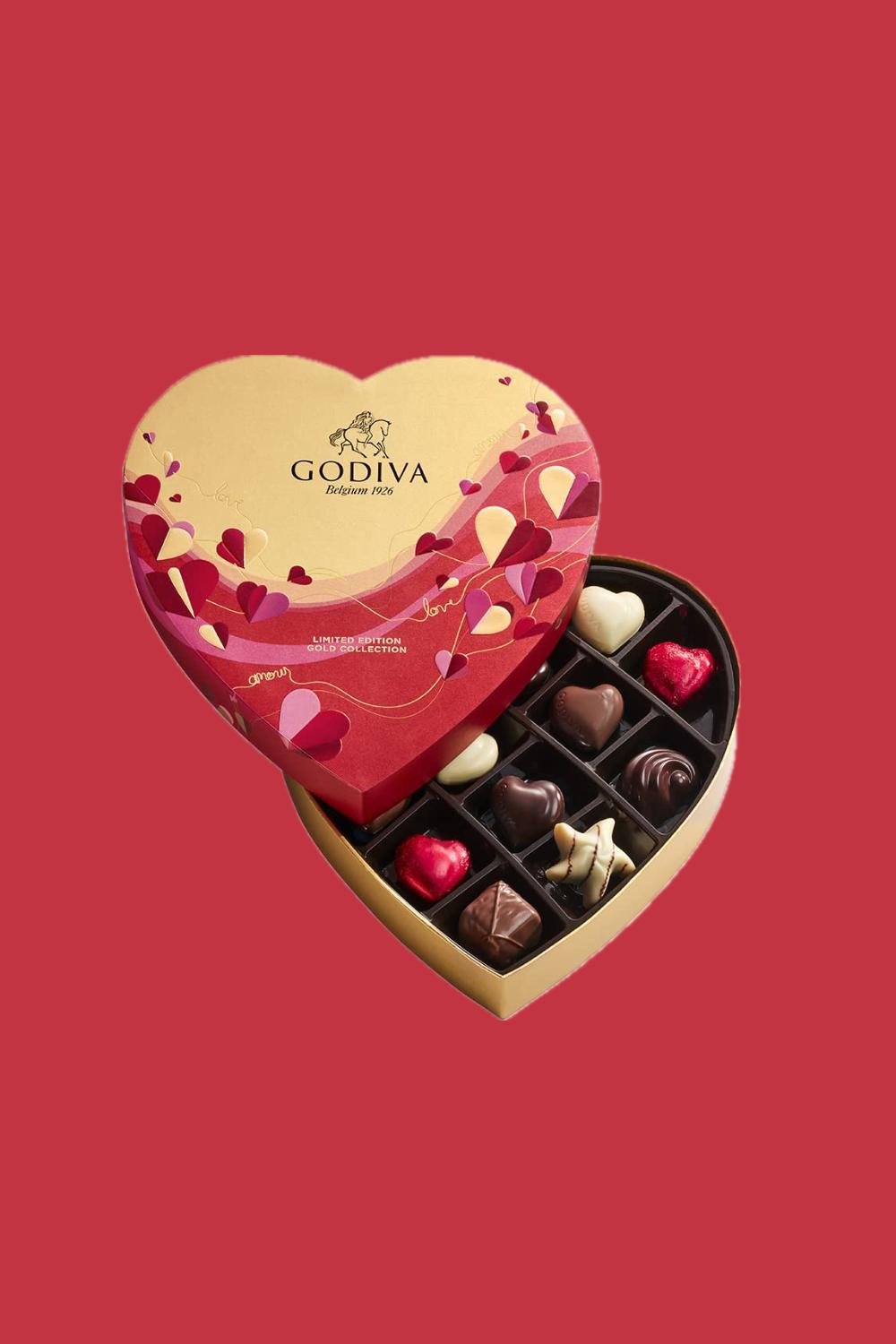 A heart-shaped chocolate box with chocolates inside.