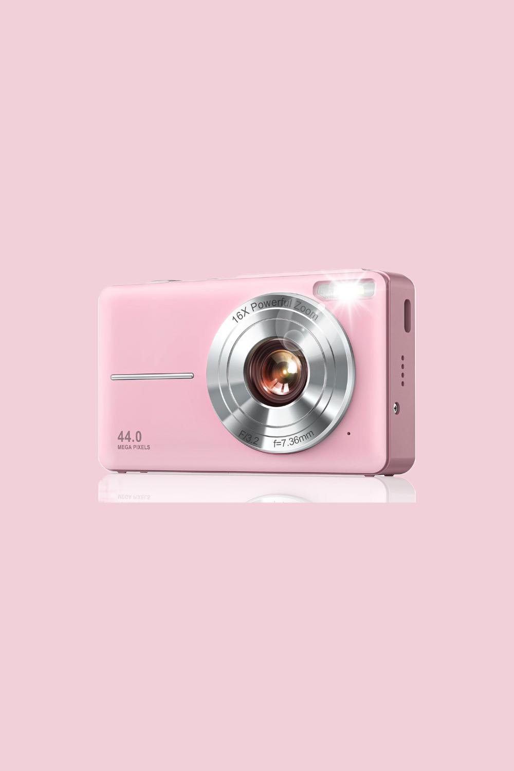 pink digital camera with silver lenses